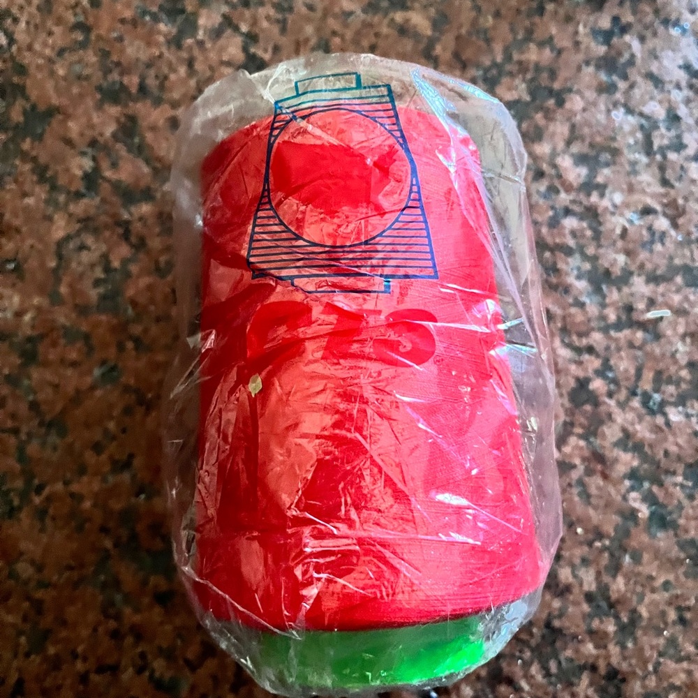 Red polyester thread cone